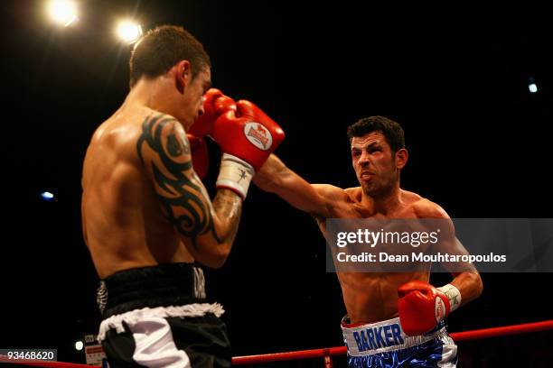 Darren Barker of Barnet lands a punch on Danny Butler of Bristol in their British and Commonwealth Middleweight bout at the Brentwood Centre on...