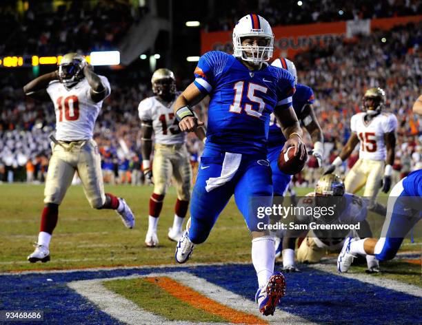 Tim Tebow of the Florida Gators runs for a touchdown during the game against the Florida State Seminoles at Ben Hill Griffin Stadium on November 28,...