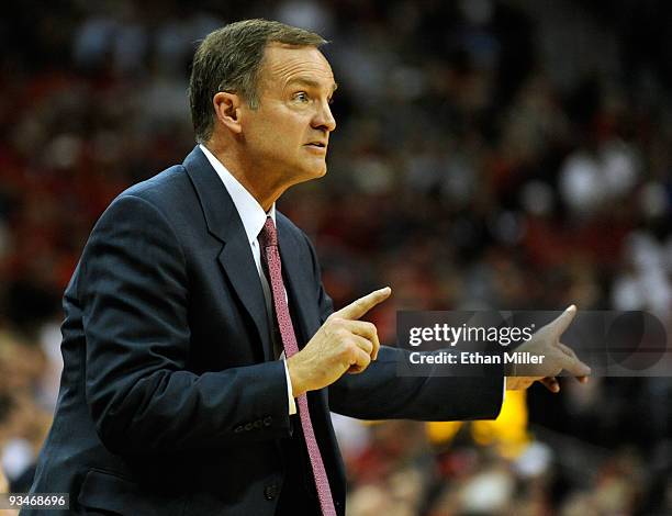 Head coach Lon Kruger of the UNLV Rebels signals to his players as they take on the Louisville Cardinals at the Thomas & Mack Center November 28,...