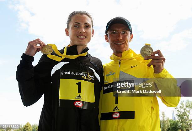Winner of the Elite female section Nikki Chapple of Australia and winner of the Elite mens section Guenther Weidlinger of Austria pose with their...