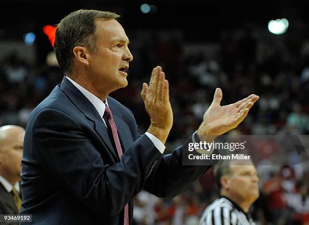 Head coach Lon Kruger of the UNLV Rebels applauds his players as they take on the Louisville Cardinals at the Thomas & Mack Center November 28, 2009...