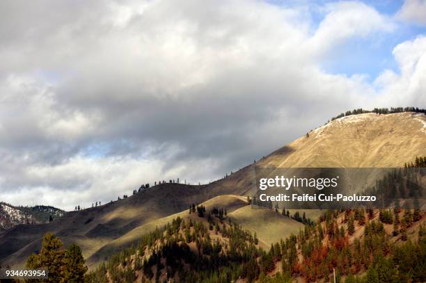 moddy sky and mountain landscape near missoula, montana, usa - montana moody sky stock pictures, royalty-free photos & images