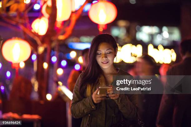 asian woman at night in downtown taipei - taiwan - taiwan shopping stock pictures, royalty-free photos & images