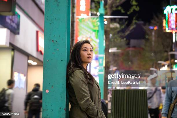 asian woman at night in downtown taipei - taiwan - ximen stock pictures, royalty-free photos & images