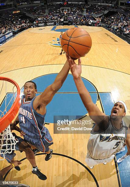 Dominic McGuire of the Washington Wizards rebounds the basketball against Derrick Brown of the Charlotte Bobcats during the game on November 28, 2009...