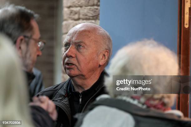 French political activist Olivia Zemor accompanied by Former French bishop Jacques Gaillot waits in the court of Versailles, near Paris on March 19,...