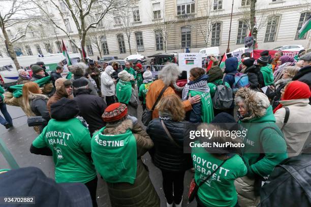 Protestors wear green T-shirts reading « Boycott Israel » during a demonstration on March 19 in front of the court of Versailles, near Paris, in...