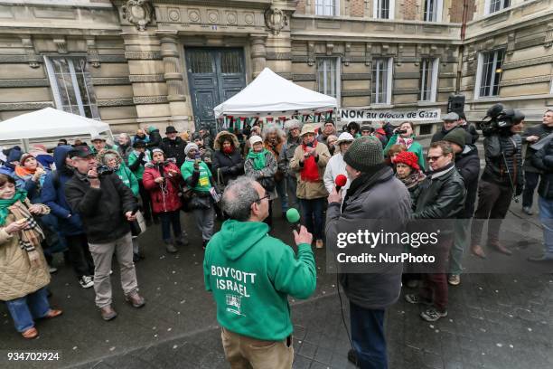 Protestors wear green T-shirts reading « Boycott Israel » during a demonstration on March 19 in front of the court of Versailles, near Paris, in...