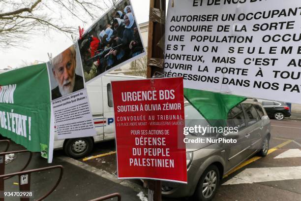 Signs againts Israel during a demonstration on March 19 in front of the court of Versailles, near Paris, in support of French political activist...