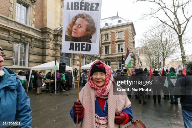Woman holds a sign during a demonstration on March 19 in front of the court of Versailles, near Paris, in support of French political activist Olivia...