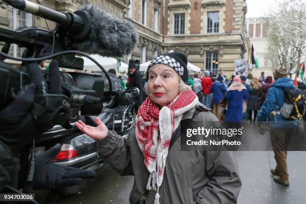 French political activist Olivia Zemor speaks with a journalist during a demonstration on March 19 in front of the court of Versailles, near Paris....