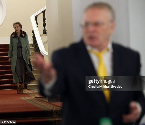 Russian liberal opposition leader Ksenia Sobchak looks on LDPR Party leader Vladimir Zhirinovsky after ther meeting of candidates for 2018...