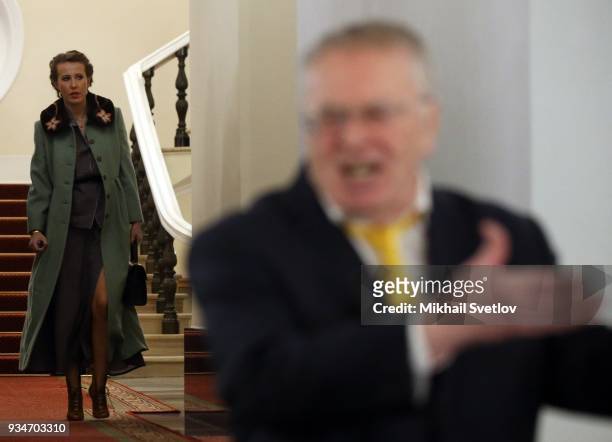 Russian liberal opposition leader Ksenia Sobchak looks on LDPR Party leader Vladimir Zhirinovsky after ther meeting of candidates for 2018...