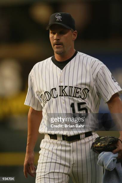 Pitcher Denny Neagle of the Colorado Rockies walks on the field during the MLB game against the San Francisco Giants on July 2, 2002 at Coors Field...