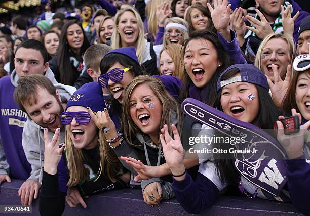 Washington Huskies fans cheer during the game against the Washington State Cougars on November 28, 2009 at Husky Stadium in Seattle, Washington. The...