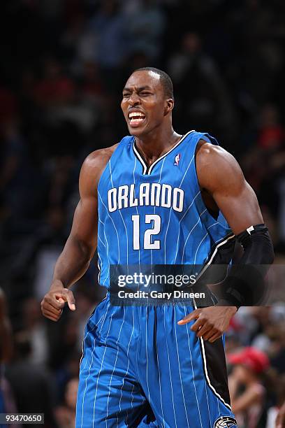 Dwight Howard of the Orlando Magic reacts after a 100-98 win against the Milwaukee Bucks on November 28, 2009 at the Bradley Center in Milwaukee,...