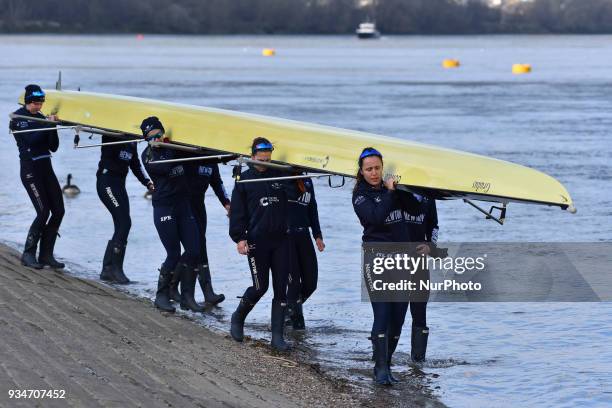 Oxford and Cambridge's women and men teams are seen during a training session in te area of Putney, London on March 19, 2018. The Boat Races will see...