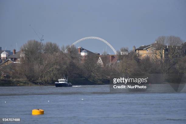 Oxford and Cambridge's women and men teams are seen during a training session in te area of Putney, London on March 19, 2018. The Boat Races will see...