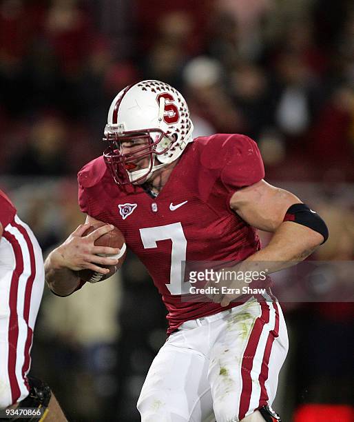 Toby Gerhart of the Stanford Cardinal runs with the ball during their game against the Notre Dame Fighting Irish at Stanford Stadium on November 28,...