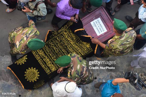 Coffin bearing the body of a victim of last week's plane crash in Nepal, is brought in for a ceremony for relatives and other people to pay their...