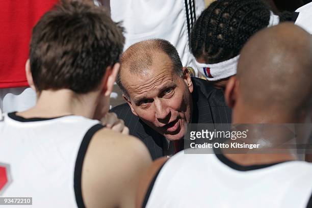 Head Coach Bob MacKinnon of the Idaho Stampede talks to his team during a timeout against the Reno Bighorns at Qwest Arena on November 28, 2009 in...