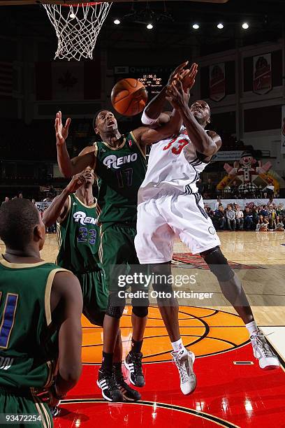 Bryson McKenzie of the Idaho Stampede goes up to the basket against Rod Benson of the Reno Bighorns at Qwest Arena on November 28, 2009 in Boise,...