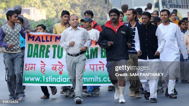 Indian mountaineer Malli Mastan Babu run with Manav Sadhna members in Ahmedabad on November 29 as part of a morale run with some 125 underpriviledged...