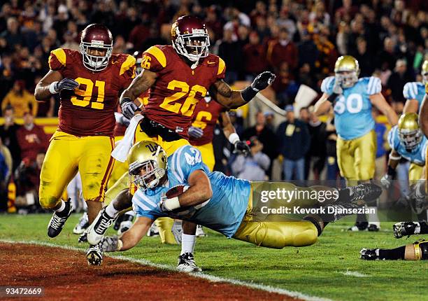 Chane Moline of the UCLA Bruins scores a touch down against USC Trojans during the fourth quarter of the NCAA college football game at Los Angeles...