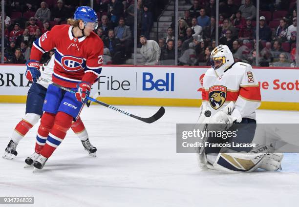 Roberto Luongo of the Florida Panthers makes a save in front of Jacob De La Rose of the Montreal Canadiens in the NHL game at the Bell Centre on...