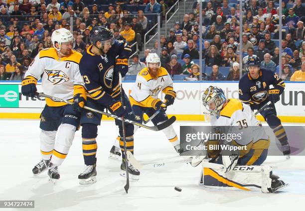 Nicholas Baptiste of the Buffalo Sabres looks for a rebound as Pekka Rinne of the Nashville Predators makes a save during an NHL game on March 19,...