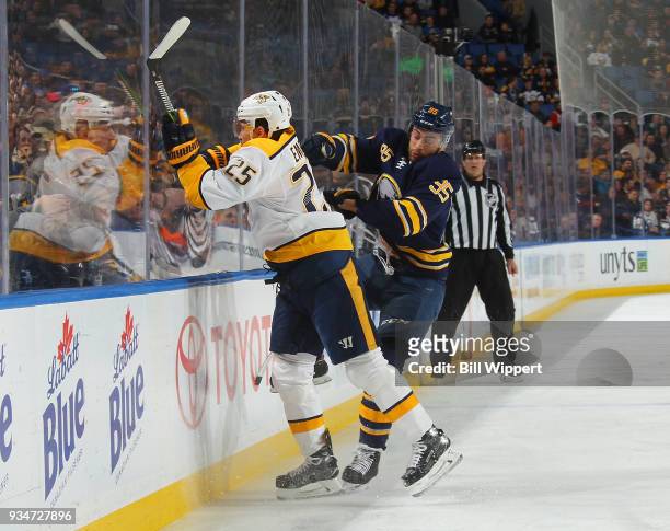 Justin Bailey of the Buffalo Sabres checks Alexei Emelin of the Nashville Predators during an NHL game on March 19, 2018 at KeyBank Center in...