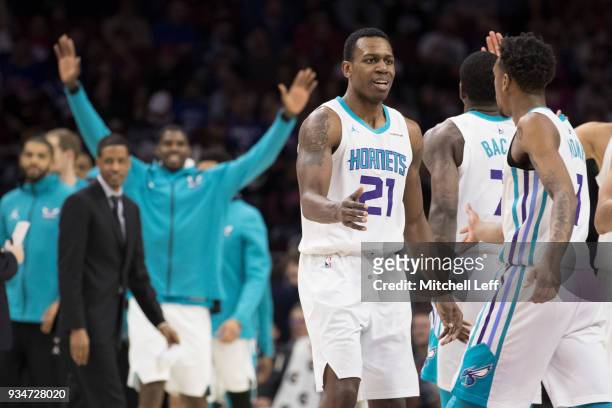 Treveon Graham of the Charlotte Hornets celebrates with Malik Monk during a timeout in the second quarter against the Philadelphia 76ers at the Wells...