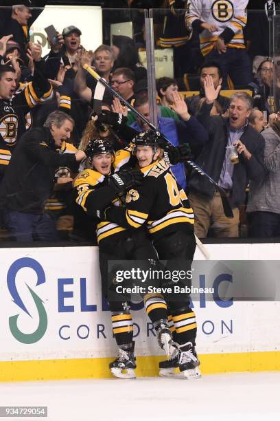 Ryan Donato and Danton Heinen of the Boston Bruins celebrate Ryan's first NHL goal against the Columbus Blue Jackets at the TD Garden on March 19,...