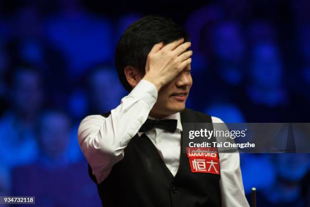 Ding Junhui of China looks on during his first round match against Mark Allen of Northern Ireland on day one of 2018 Ladbrokes Players Championship...