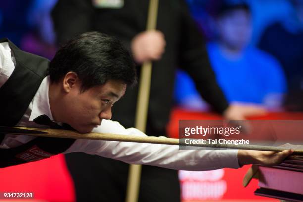 Ding Junhui of China plays a shot during his first round match against Mark Allen of Northern Ireland on day one of 2018 Ladbrokes Players...