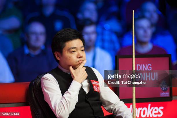 Ding Junhui of China looks on during his first round match against Mark Allen of Northern Ireland on day one of 2018 Ladbrokes Players Championship...