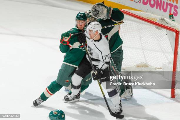 Devan Dubnyk and Nick Seeler of the Minnesota Wild defend their goal against Tanner Pearson of the Los Angeles Kings during the game at the Xcel...