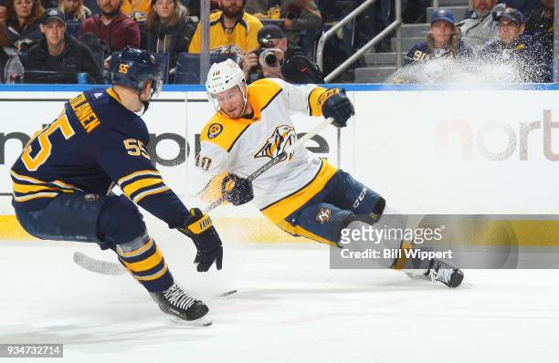 Colton Sissons of the Nashville Predators skates against Rasmus Ristolainen of the Buffalo Sabres during an NHL game on March 19, 2018 at KeyBank...