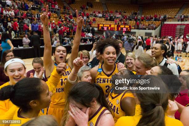 Central Michigan Chippewas forward Tinara Moore , Central Michigan Chippewas head coach Sue Guevara and team celebrate after winning the second round...