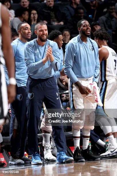 JaMychal Green and Chandler Parsons of the Memphis Grizzlies cheer from the bench during the game against the Brooklyn Nets on March 19, 2018 at...