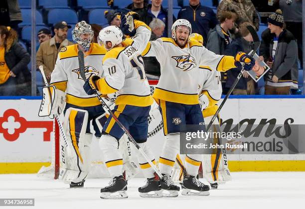 Anthony Bitetto celebrates a 4-0 win with Colton Sissons of the Nashville Predators against the Buffalo Sabres during an NHL game at KeyBank Center...