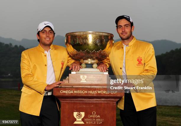 Francesco Molinari, Edoardo Molinari of Italy hold the trophy after winning the Omega Mission Hills World Cup on the Olazabal course on November 29,...