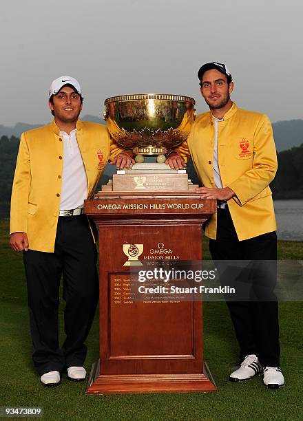 Francesco Molinari, Edoardo Molinari of Italy hold the trophy after winning the Omega Mission Hills World Cup on the Olazabal course on November 29,...