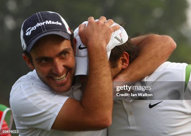 Francesco Molinari and Edoardo Molinari of Italy celebrate after winning the Omega Mission Hills World Cup on the Olazabal course on November 29,...