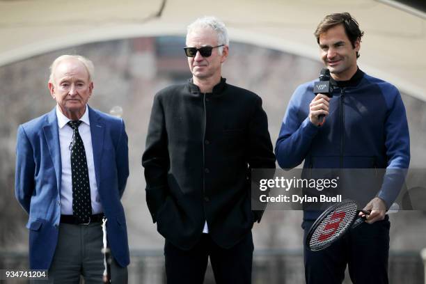 Roger Federer of Switzerland speaks to the crowd as Rod Laver and John McEnroe look on during the Laver Cup 2018 Chicago Launch at Cloud Gate on...