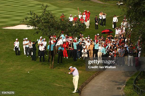 Graeme McDowell of Ireland in action during the Foursome's on the second day of the Omega Mission Hills World Cup on the Olazabal course on November...