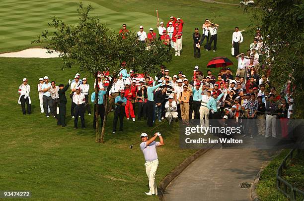 Graeme McDowell of Ireland in action during the Foursome's on the second day of the Omega Mission Hills World Cup on the Olazabal course on November...