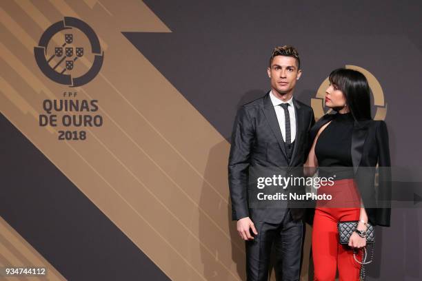 Portugal's forward Cristiano Ronaldo accompanied by Georgina Rodriguez poses on arrival at 'Quinas de Ouro' 2018 ceremony held and the Pavilhao...