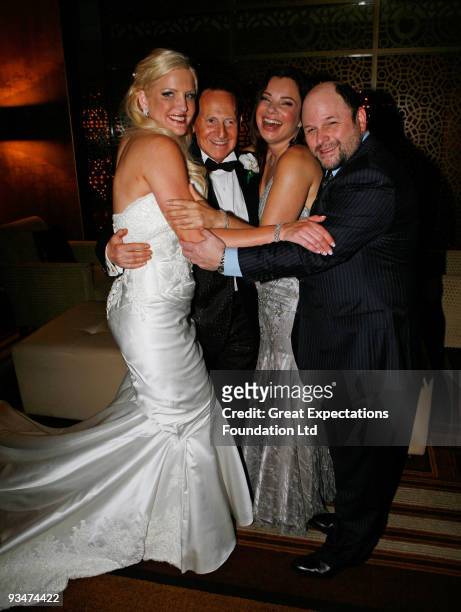 Bride Brynne Gordon and groom Geoffrey Edelsten pose for a photograph with actress Fran Drescher and actor Jason Alexander during the wedding of...