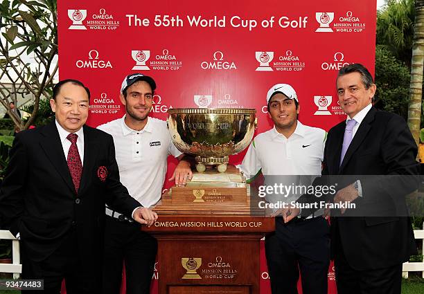 Francesco Molinari, Edoardo Molinari of Italy are presented with the trophy by Doctor David Chu, Chairman of the Mission Hills Group and Stephen...